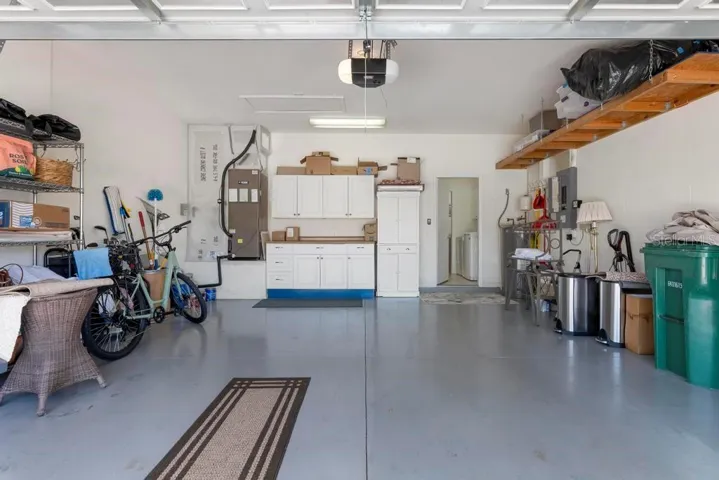Deep two car garage with built-in cabinets and storage