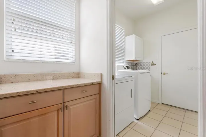 Butler pantry close up to laundry room with sink