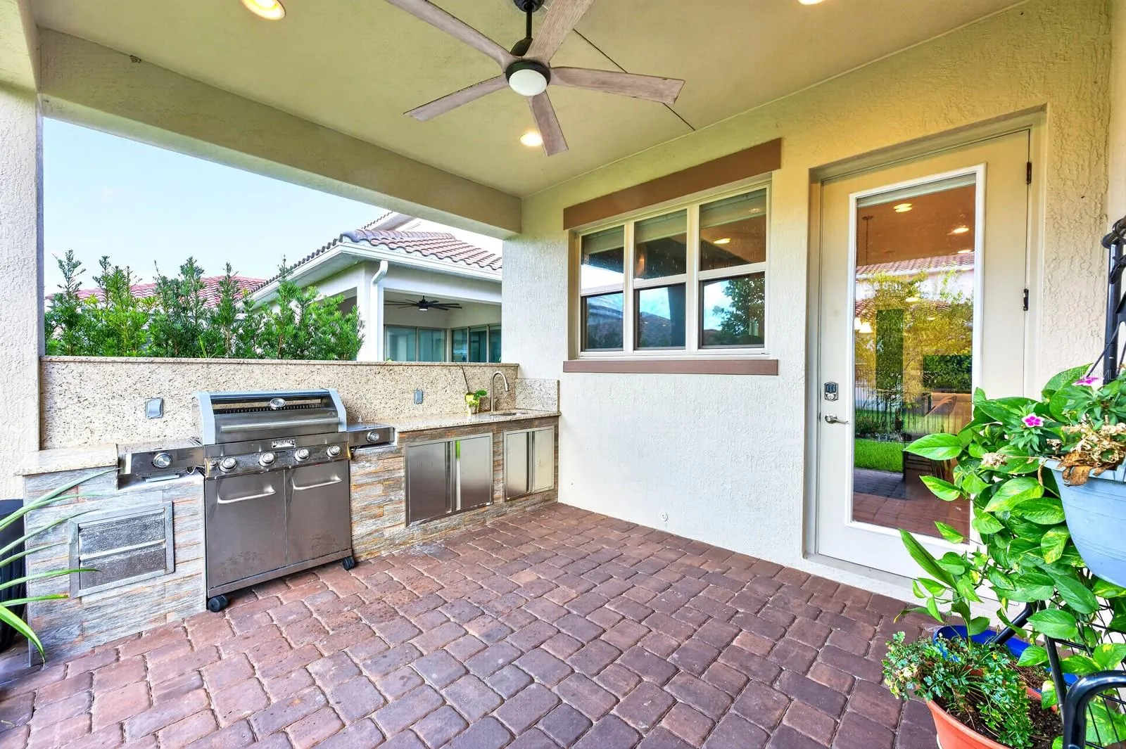 Covered paver lanai, summer kitchen.