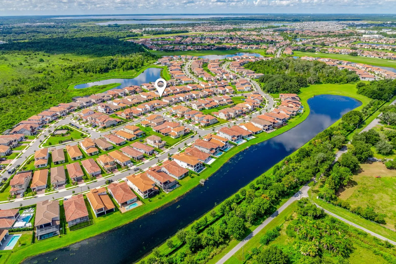 Skip the wait for new construction and enjoy a newer Lake Nona home with OWNED SOLAR, an EV CHARGER, OUTDOOR KITCHEN, FENCED YARD and exceptional Eagle Creek amenities!