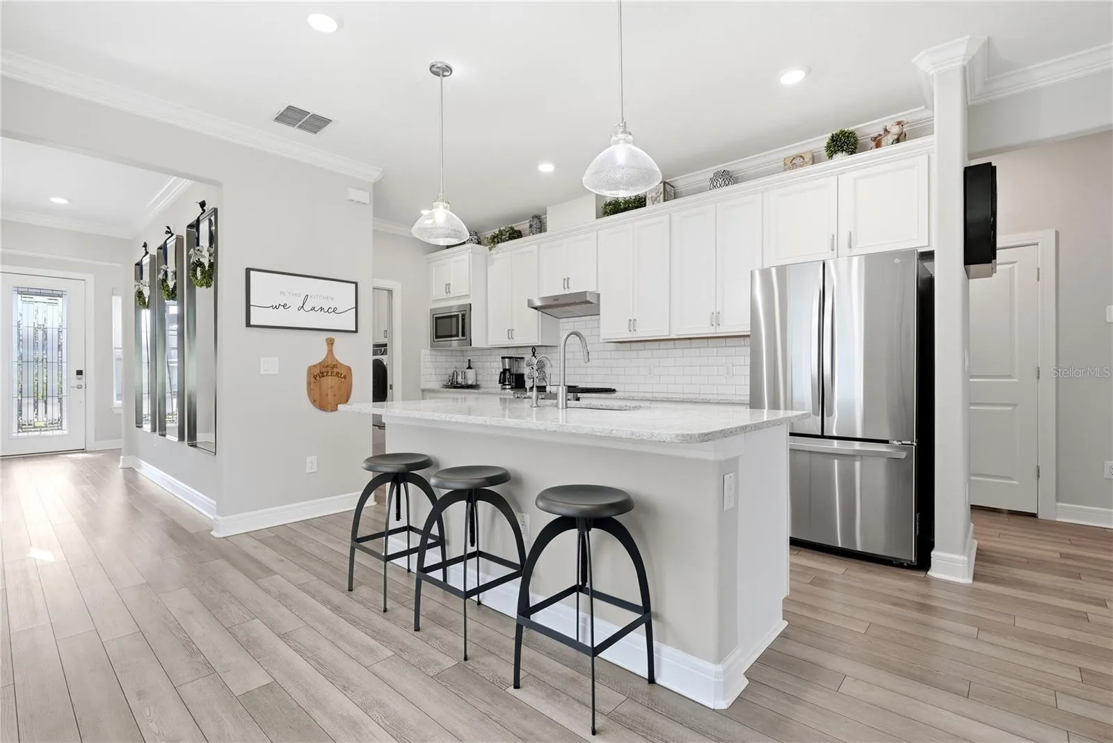 Stainless Steel appliances and subway tile.