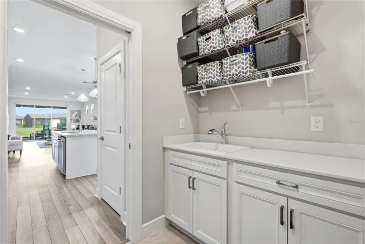 Dedicated Laundry Room with upgraded cabinets PLUS utility sink.