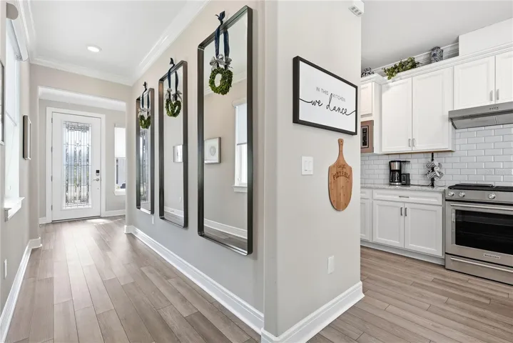 View from the kitchen to the entrance. The glass front door provides plenty of light.