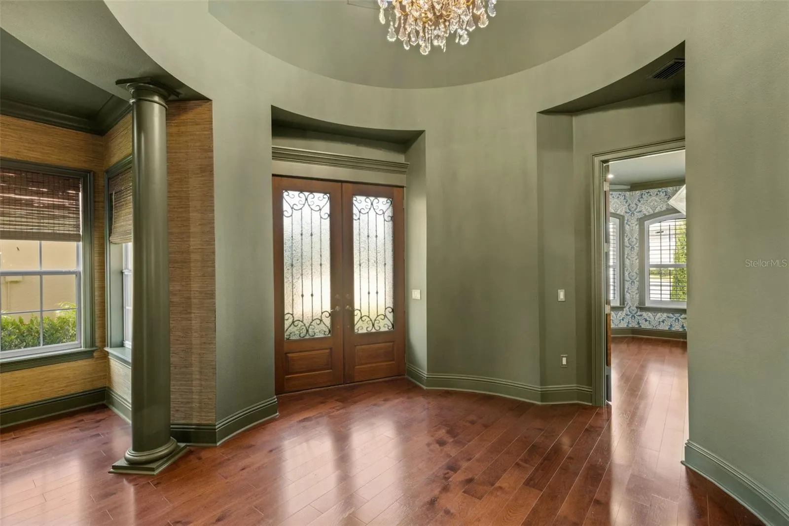 From the moment you step inside through the custom wood double doors to the signature rotunda foyer . . .