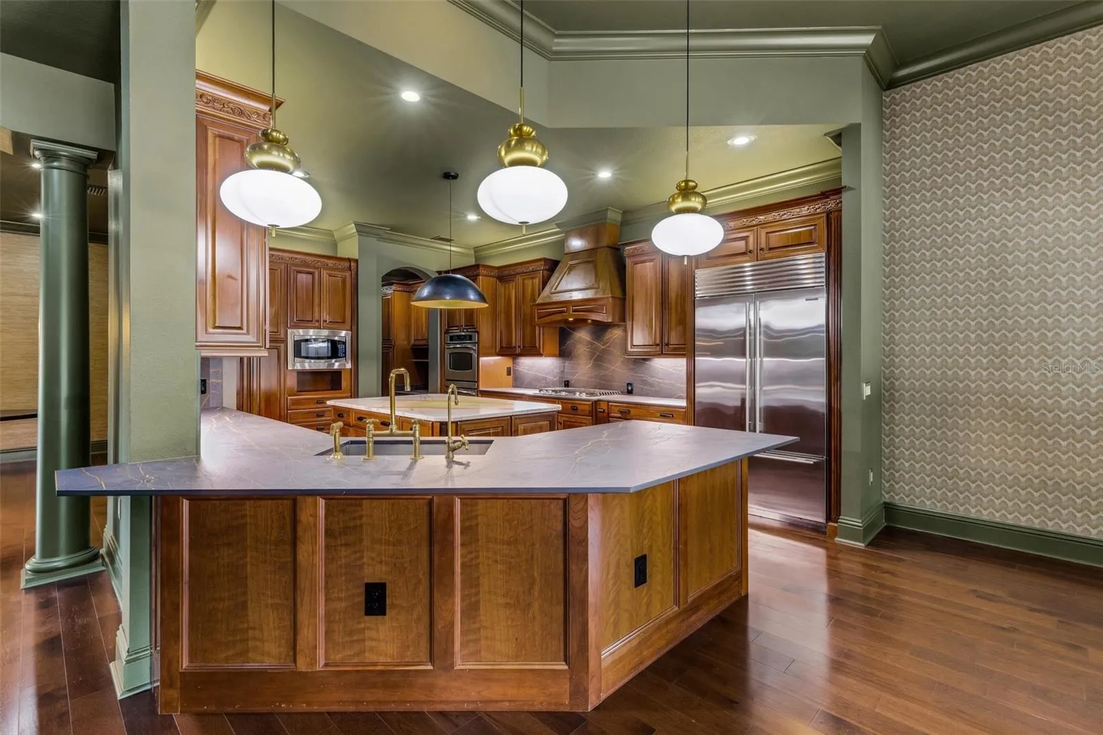 The custom Dekton countertops are made by Cosentino that blends minerals used in glass, porcelain and quartz forming an ultra durable material that is resistant to heat water, stains, UV light, and scratches and will withstand whatever you throw its way!!