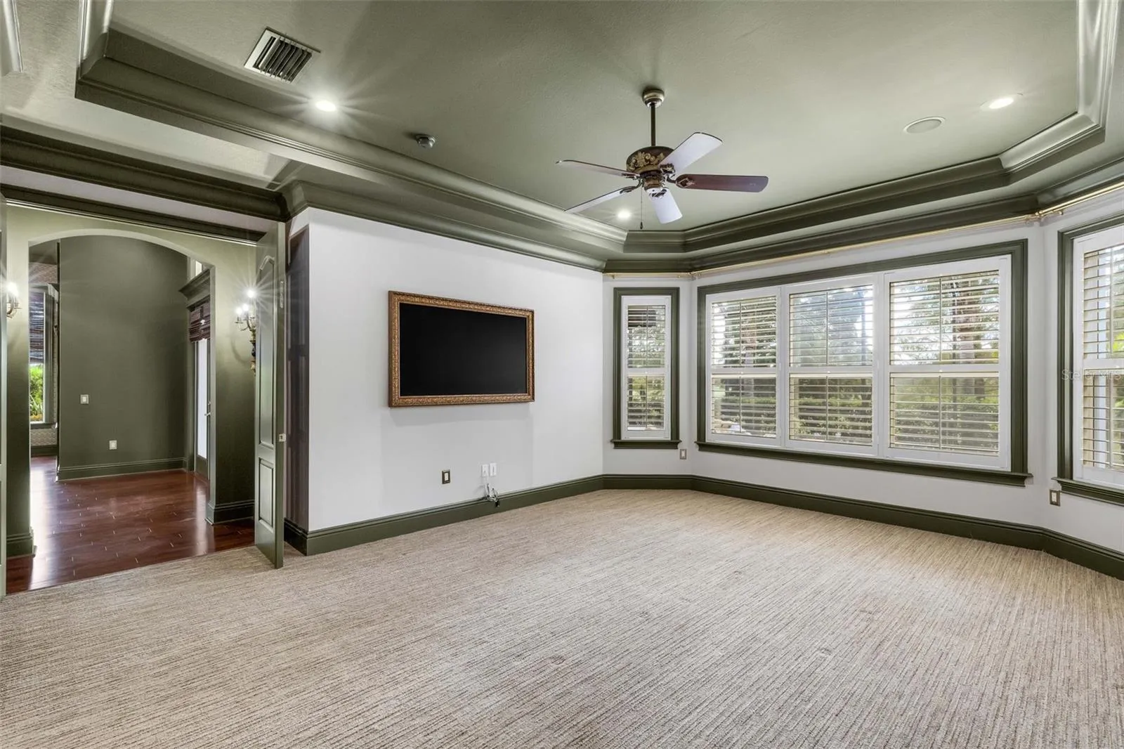 The sellers have opted to leave the framed wall mounted TV that provides a touch of elegance that the standard big screen can't come close to duplicating.