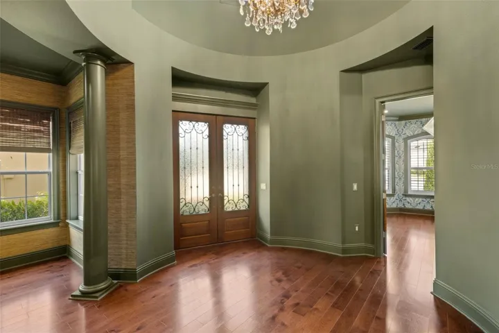 From the moment you step inside through the custom wood double doors to the signature rotunda foyer . . .