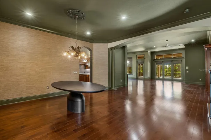 Custom grass cloth covers the wall in many of the formal spaces.