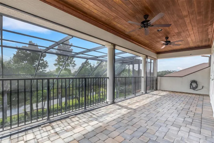 With wood ceiling above and brick pavers under foot.