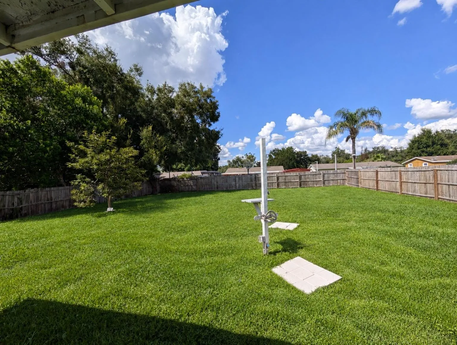 Backyard - outdoor shower ready for your future pool!