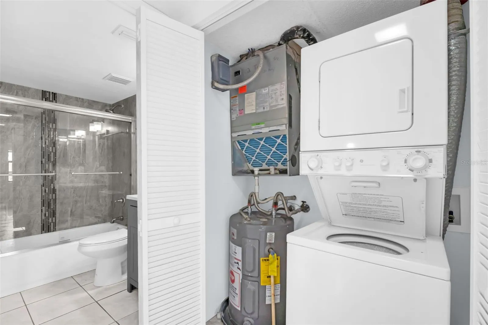 Laundry Closet with new Washer Dryer and utility