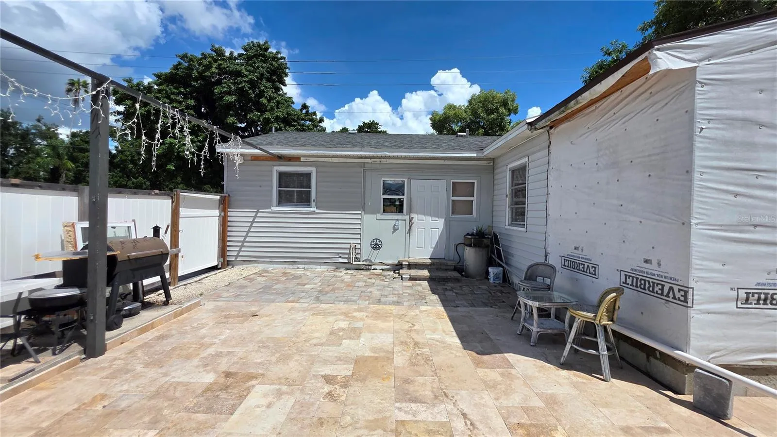 Back of Home, and Back Door Entry to Home. Addition partially added will need to be removed.