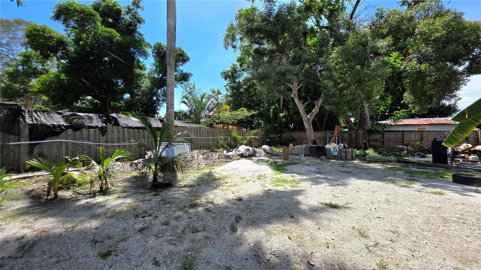 Backyard, Oversized Lot, Fully Fenced, Side driveway with Gated Entry to Backyard, Smaller Driveway on Back of Lot