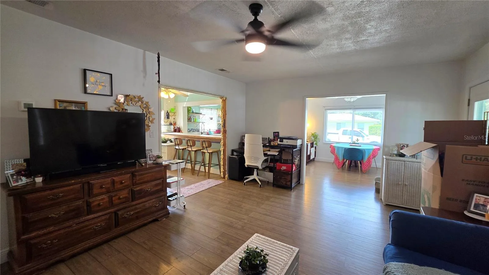 Living Room adjacent to Dining/Flex Room and Inside Laundry Area