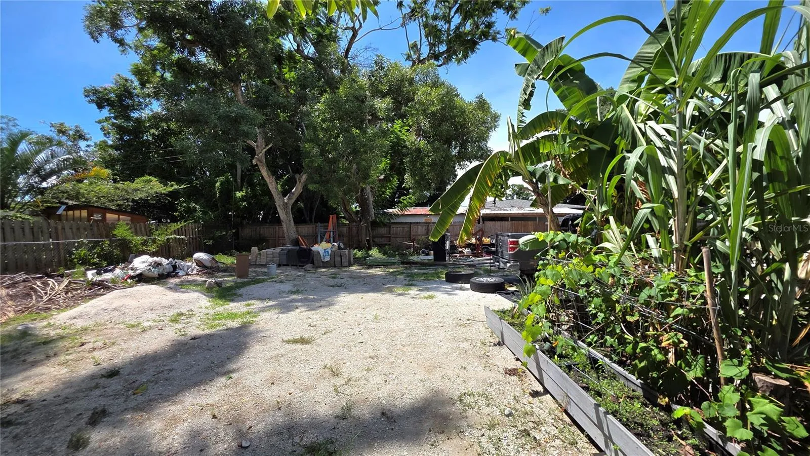 Backyard, Oversized Lot, Fully Fenced, Side driveway with Gated Entry to Backyard, Smaller Driveway on Back of Lot