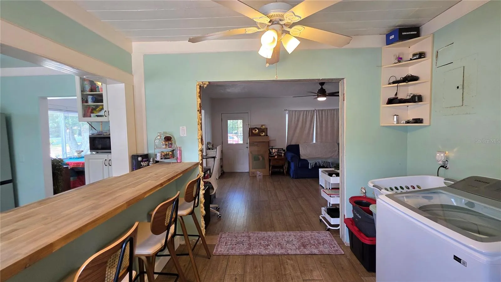 Inside Laundry Area, Breakfast Bar &amp; Seating, View to Living Room &amp; Entry