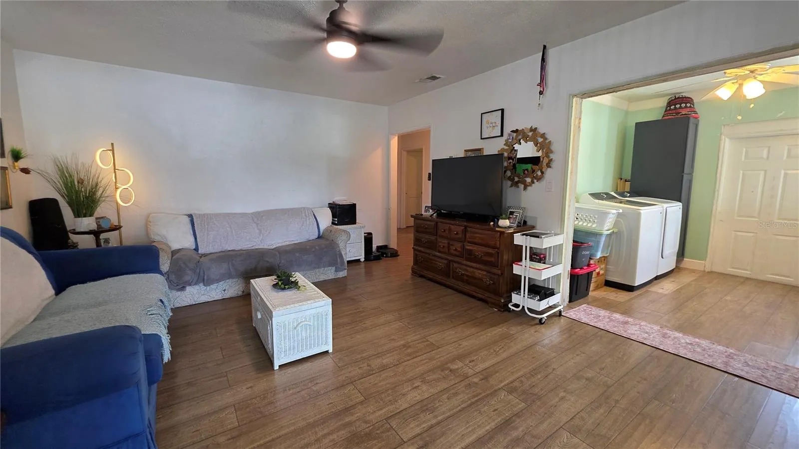 Living Room adjacent to Inside Laundry Area and Back Door