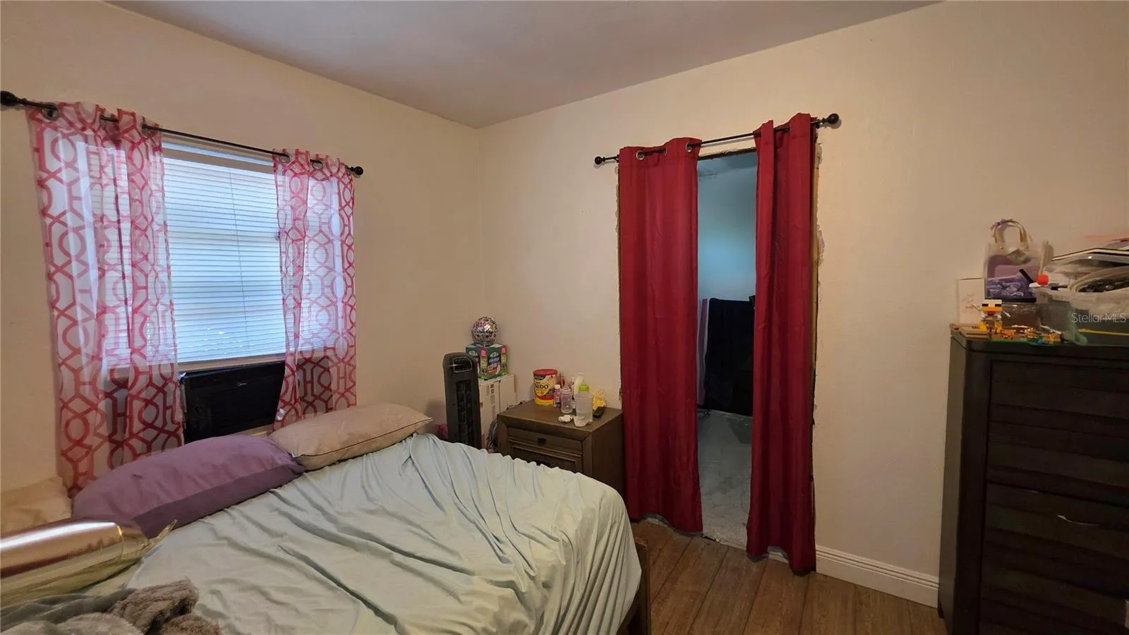 Bedroom #2 with Laminate Flooring and Window to Side Yard View (Entry to En-Suite Bathroom Addition - will need to be removed)