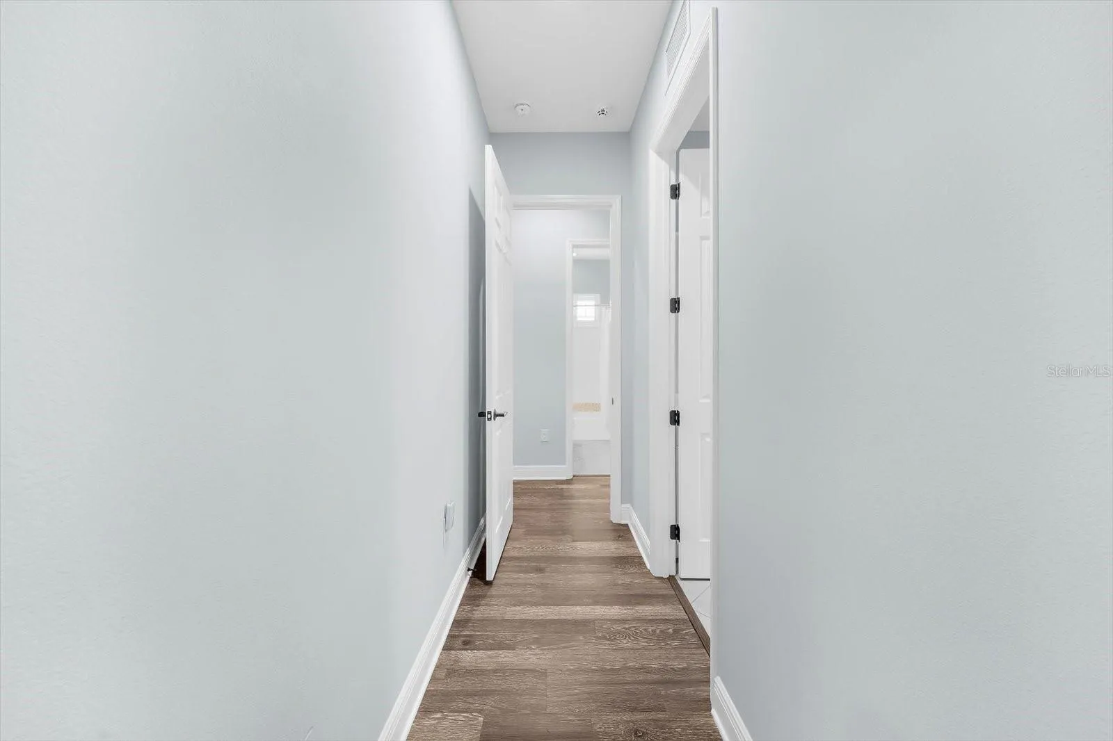 Hallway to Laundry Room, Garage and 2nd & 3rd Bedrooms and 2nd Bath