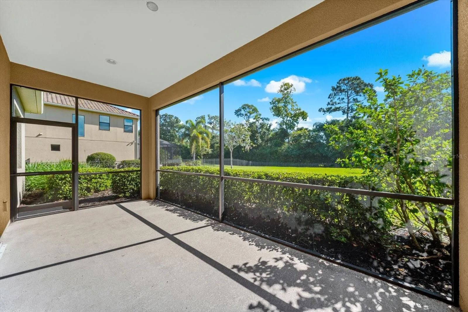 Screened In Porch Overlooking the Fenced in Back Yard