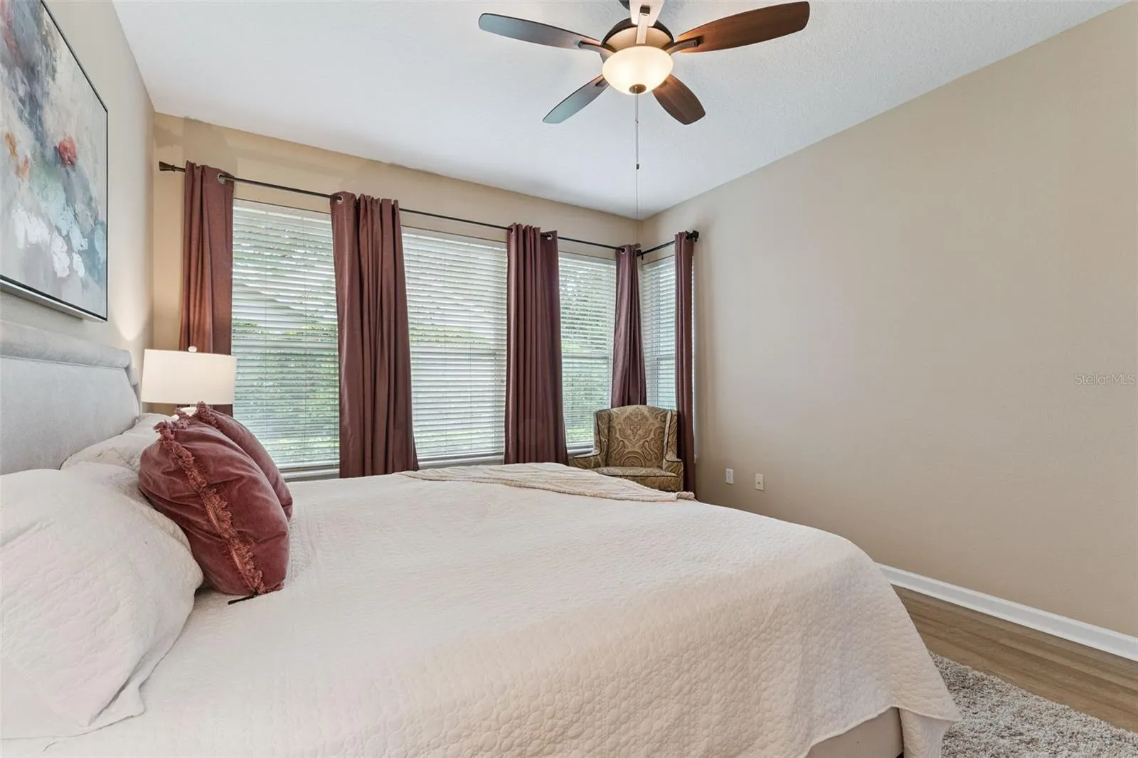 Primary Bedroom w/ a view to the private backyard