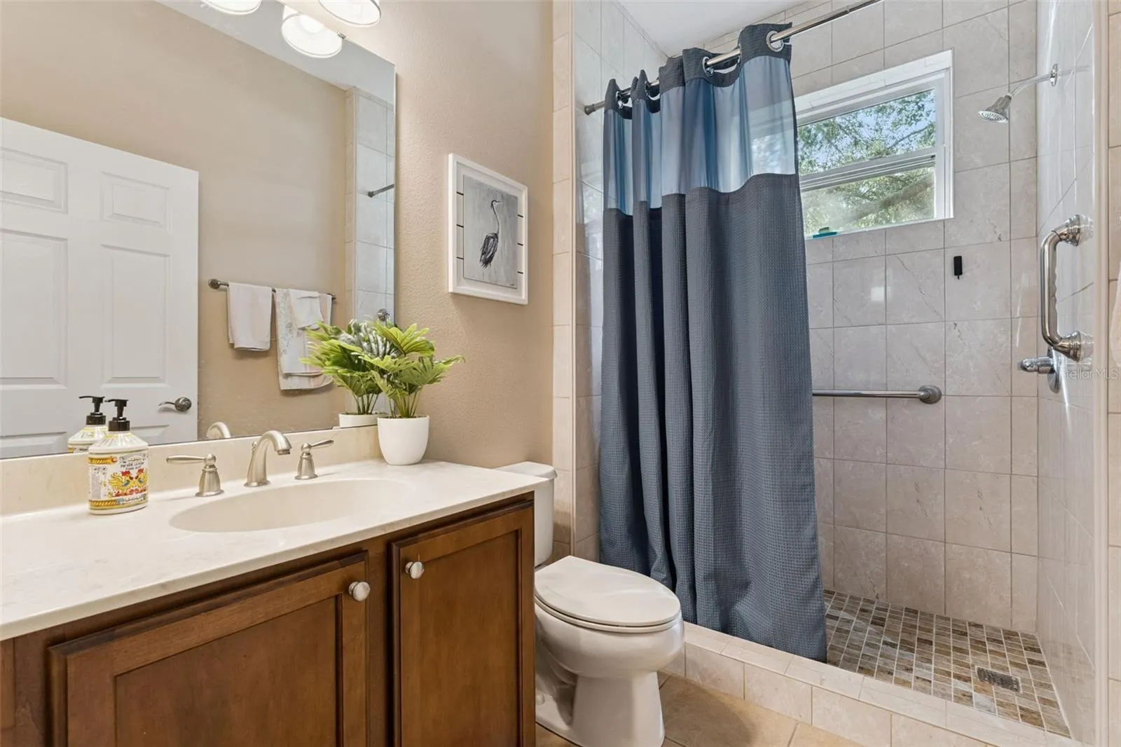 Guest Bathroom w/ a walk-in shower & grab bars