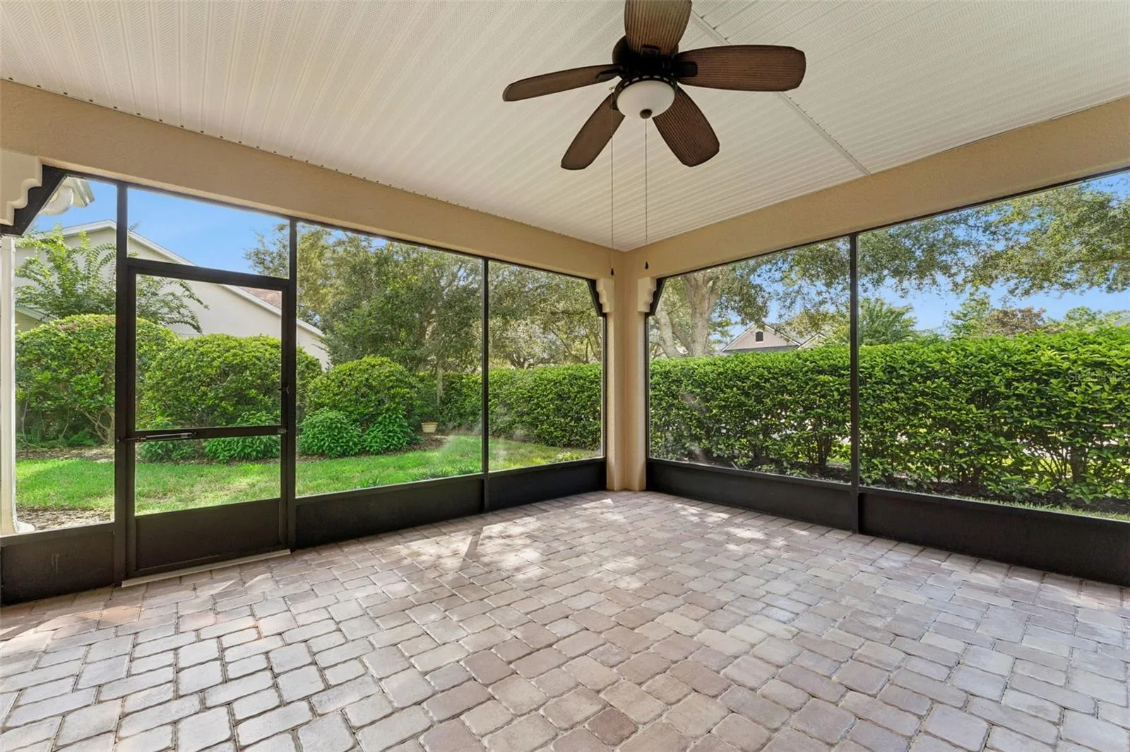 18' x 16'6" Screen enclosed covered patio w/ privacy landscaping
