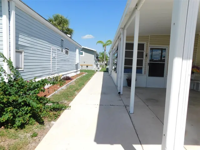 SIDEWALK TO THE UTILITY/LAUNDRY ROOM