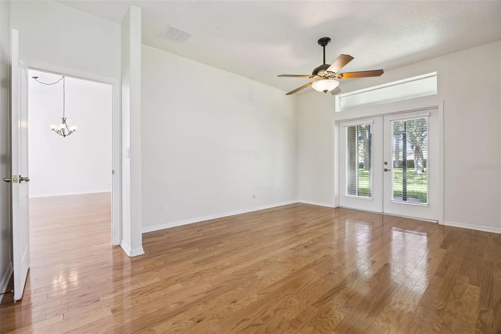 Primary Bedroom with French doors to lanai.