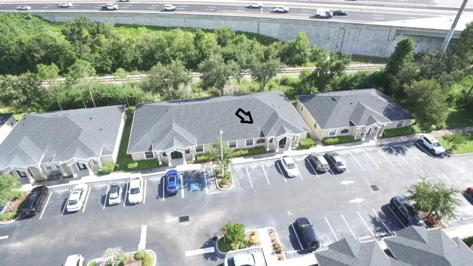 Aerial of 2 unit building. Arrow points to available 1500 sq. ft. unit on right side of building