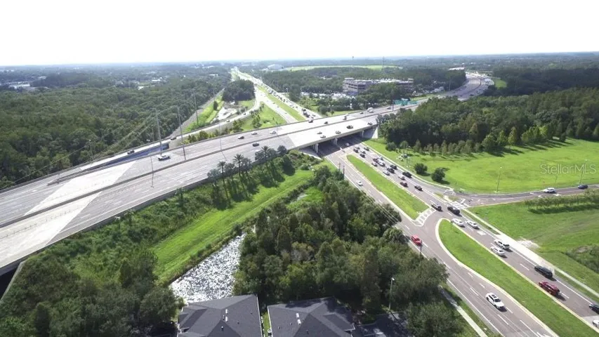 Veterans Expressway going over Linebaugh with on and off exit ramps. Subject Veterans Plaza to the south in this picture