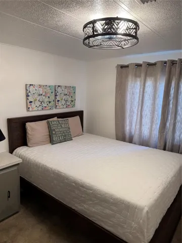 Secondary bedroom with built-in desk and full bath right across the hall