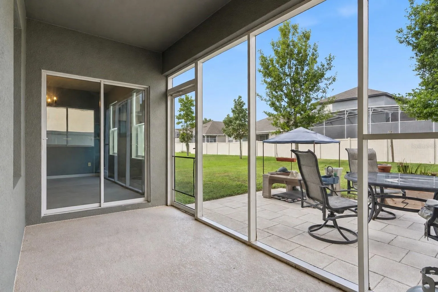 Rear Screened porch and patio