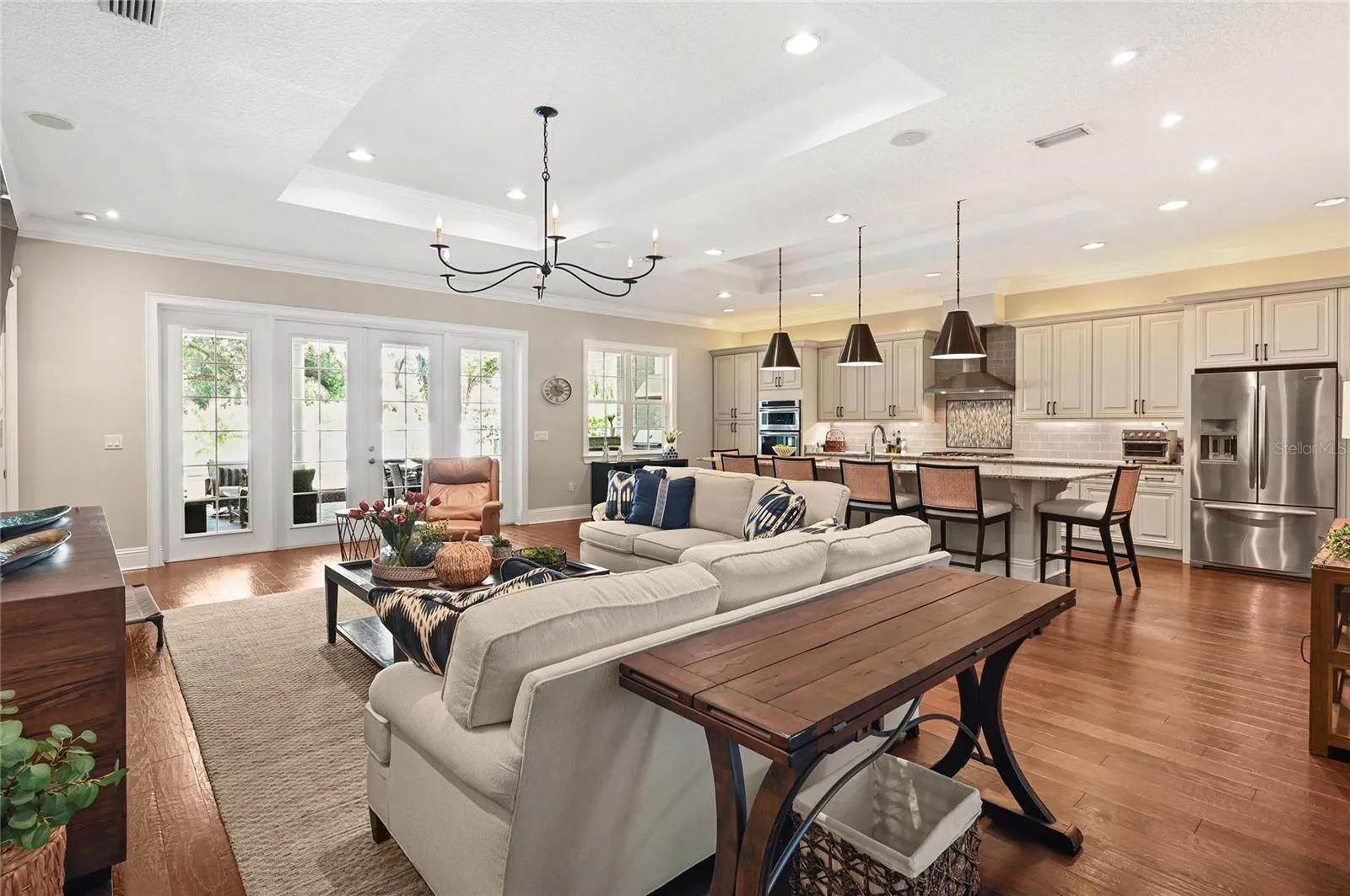 The large chef kitchen overlooks a generous family room, creating the perfect space for family and friends to gather.