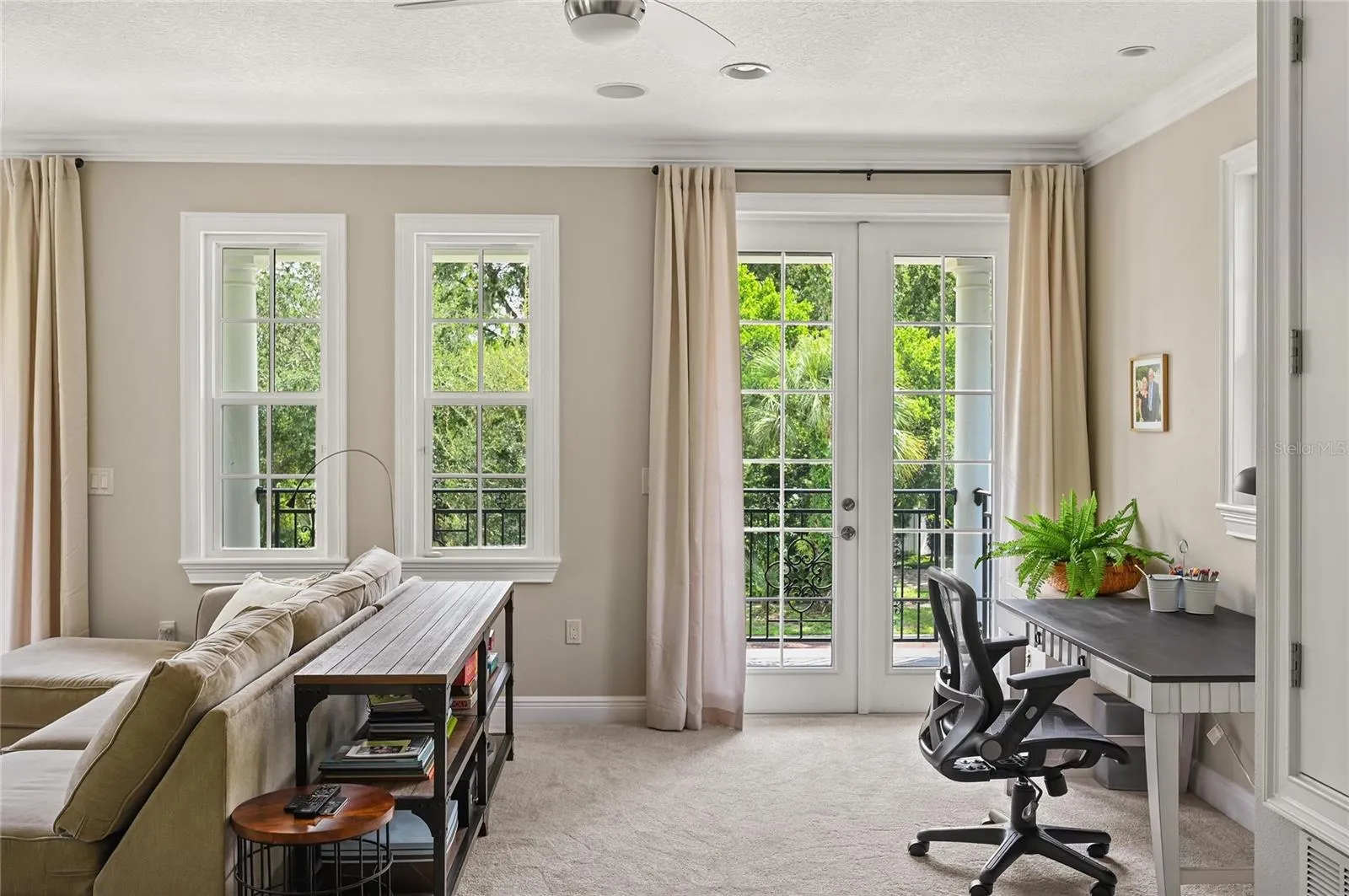 A niche area is the perfect spot for a desk, with a view to the outside.