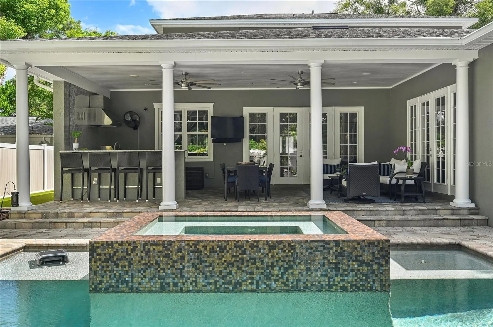 Accented by fire pits, the zen pool design makes lingering on the porch a delight.