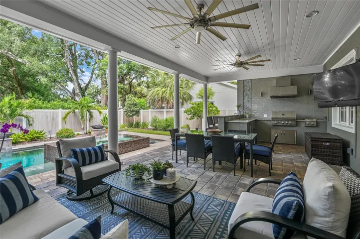 Ultimately, this outdoor living area is the favorite hub for enjoying Winter Park life under the tree canopy.