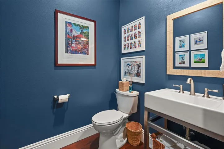 A half bath is situated in the perfect spot, convenient to all.