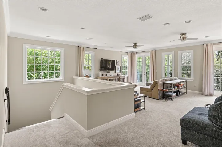 The upstairs loft feels as light, bright, and open as the main living areas.