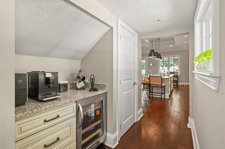 There is a coffee bar and wine fridge tucked in next to the kitchen.