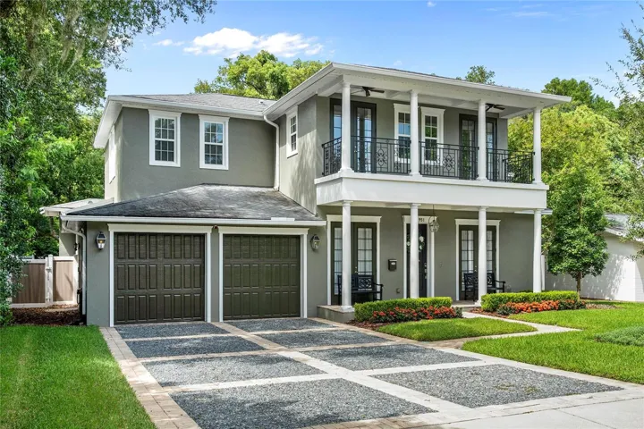 The design features large porches with ceiling fans and sweeping views.