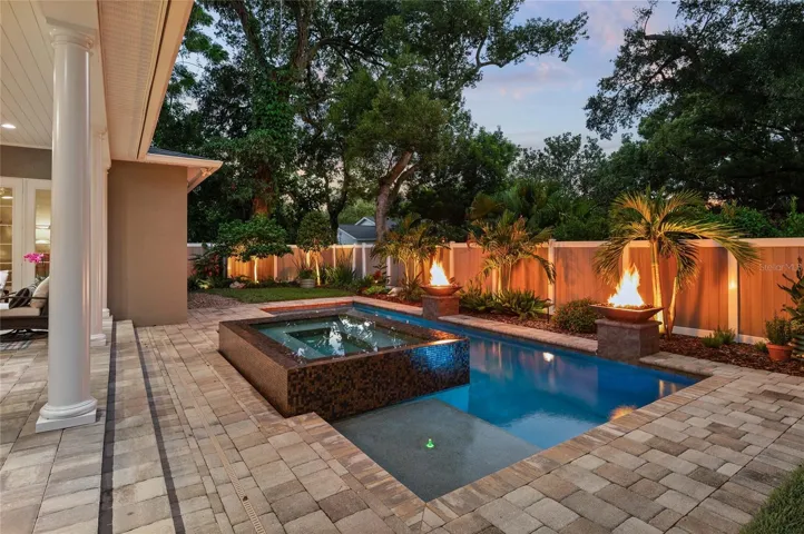 Landscape lighting creates a cozy, relaxing atmosphere at nightfall.
