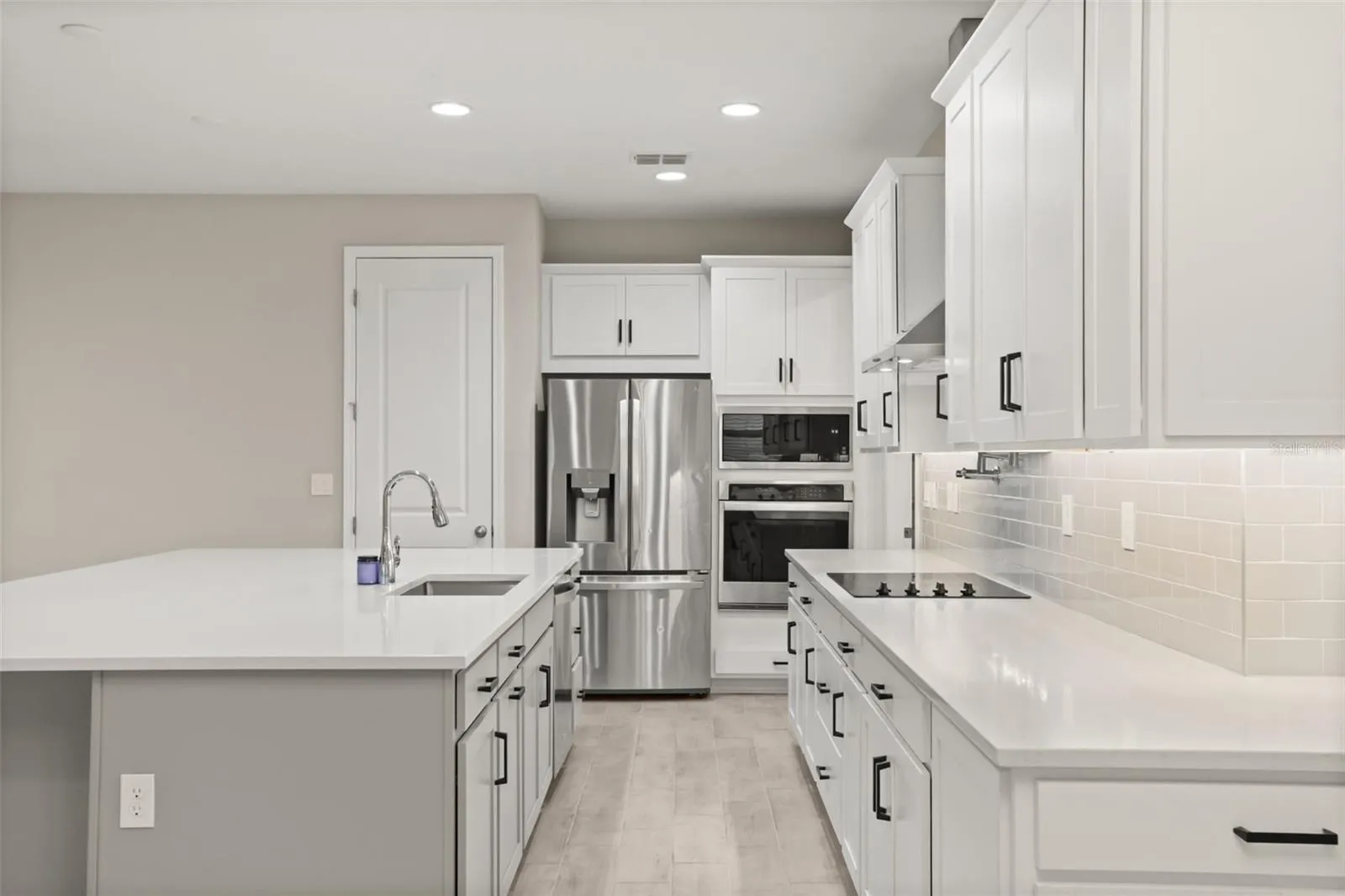 Beautiful kitchen with quartz countertops and stainless steel