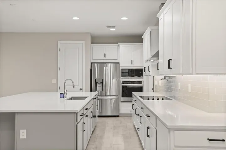Beautiful kitchen with quartz countertops and stainless steel