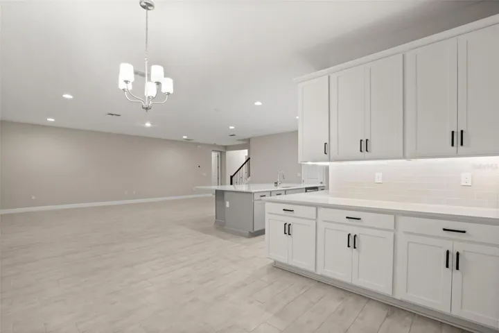 Large living area wrapped around countertops into dining area