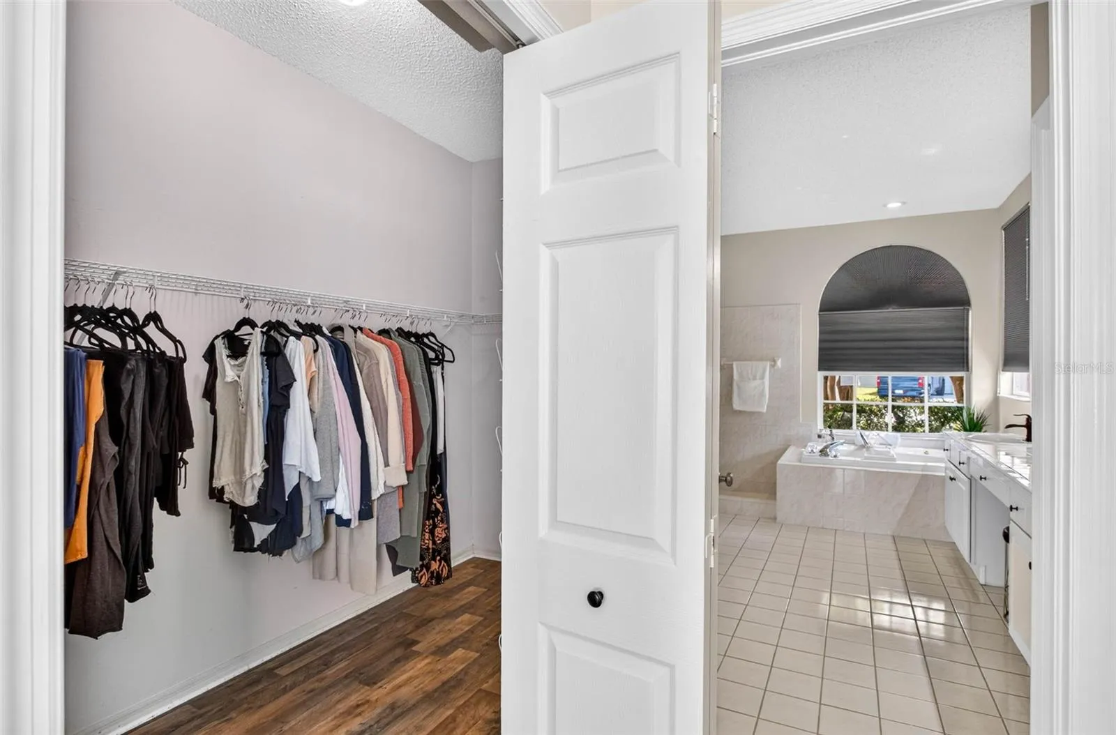 Large walk-in closet in primary suite