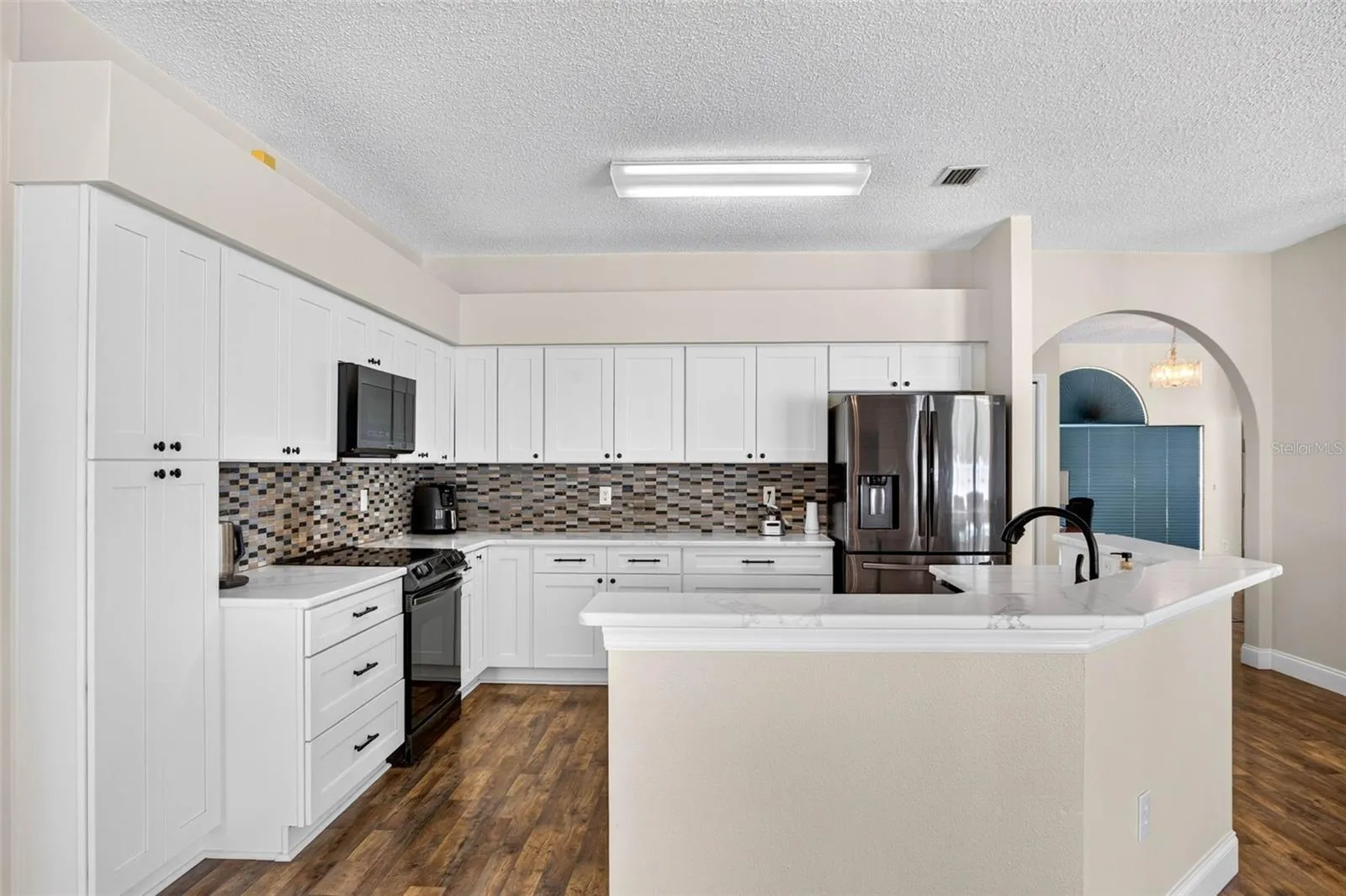 UPDATED kitchen with Quartz countertops and stainless appliances