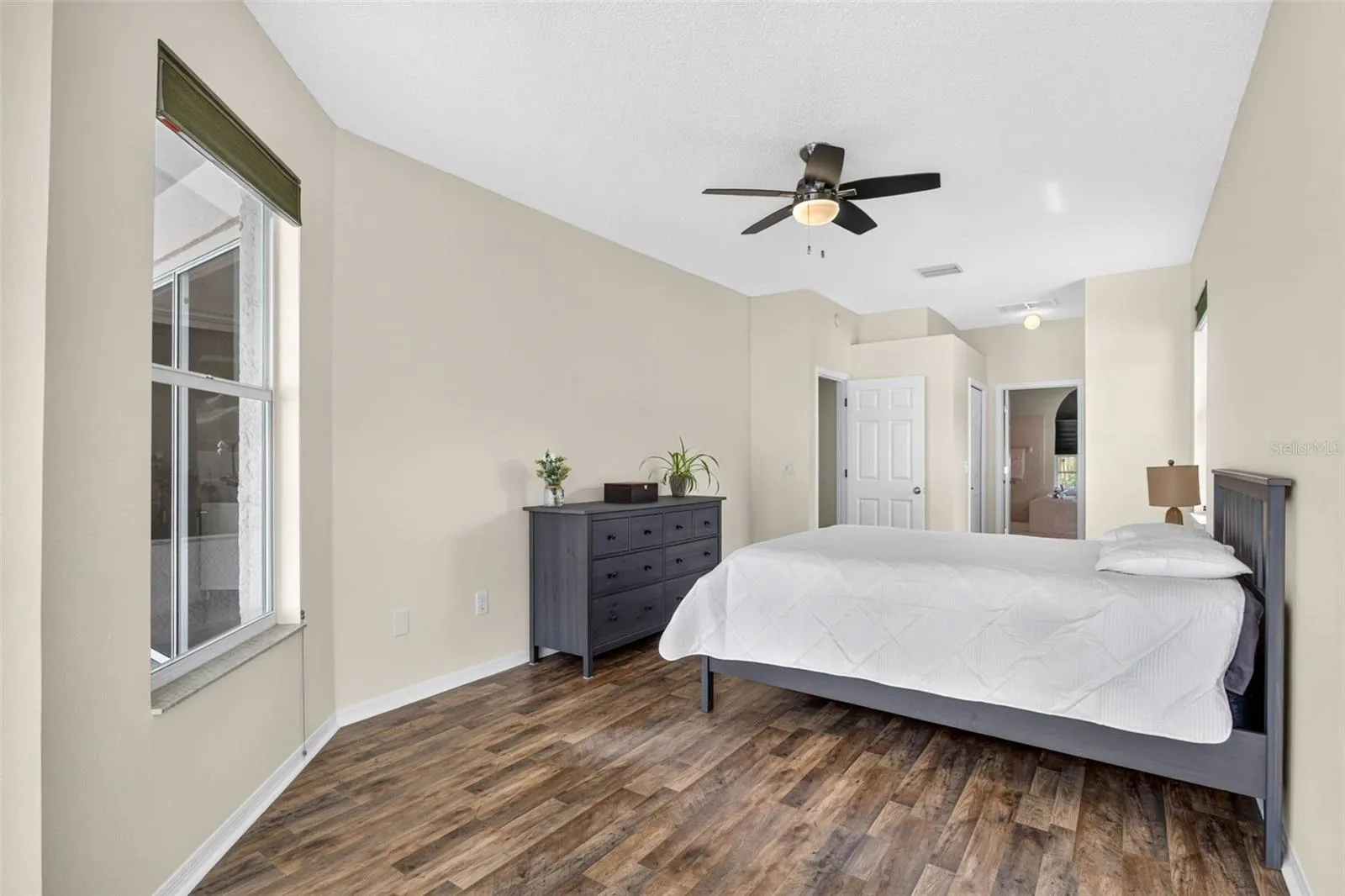 Large primary bedroom with access to pool