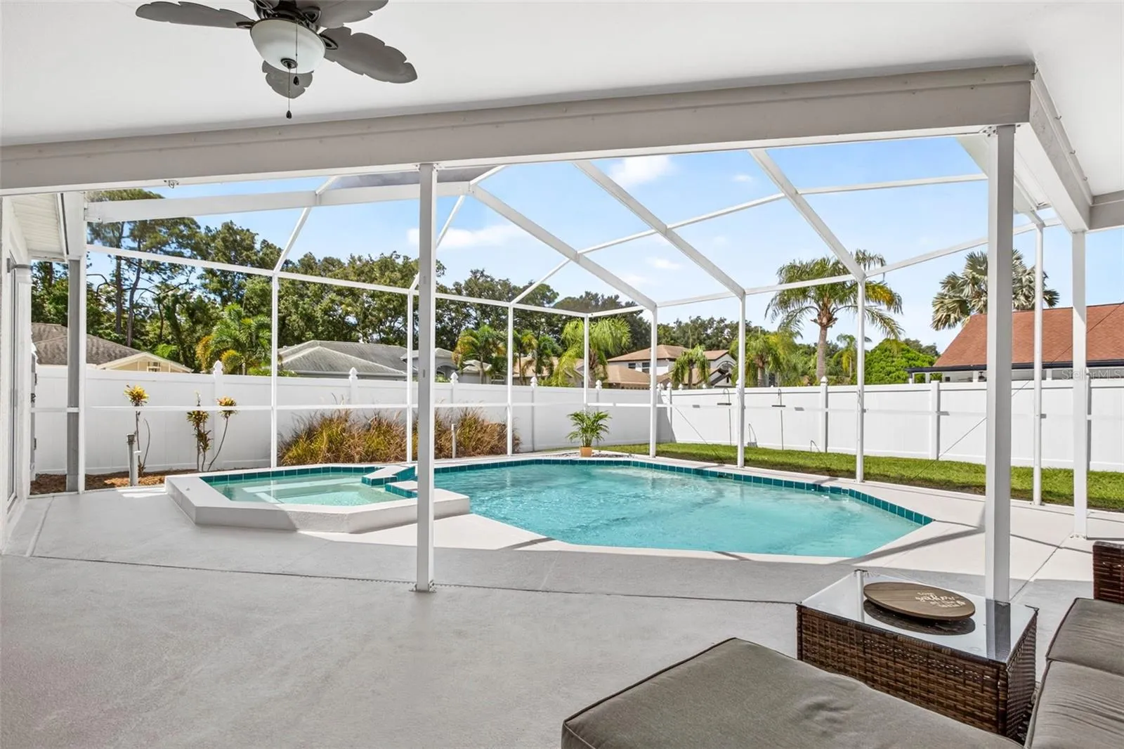 Screened pool lanai and room to play in the fenced backyard