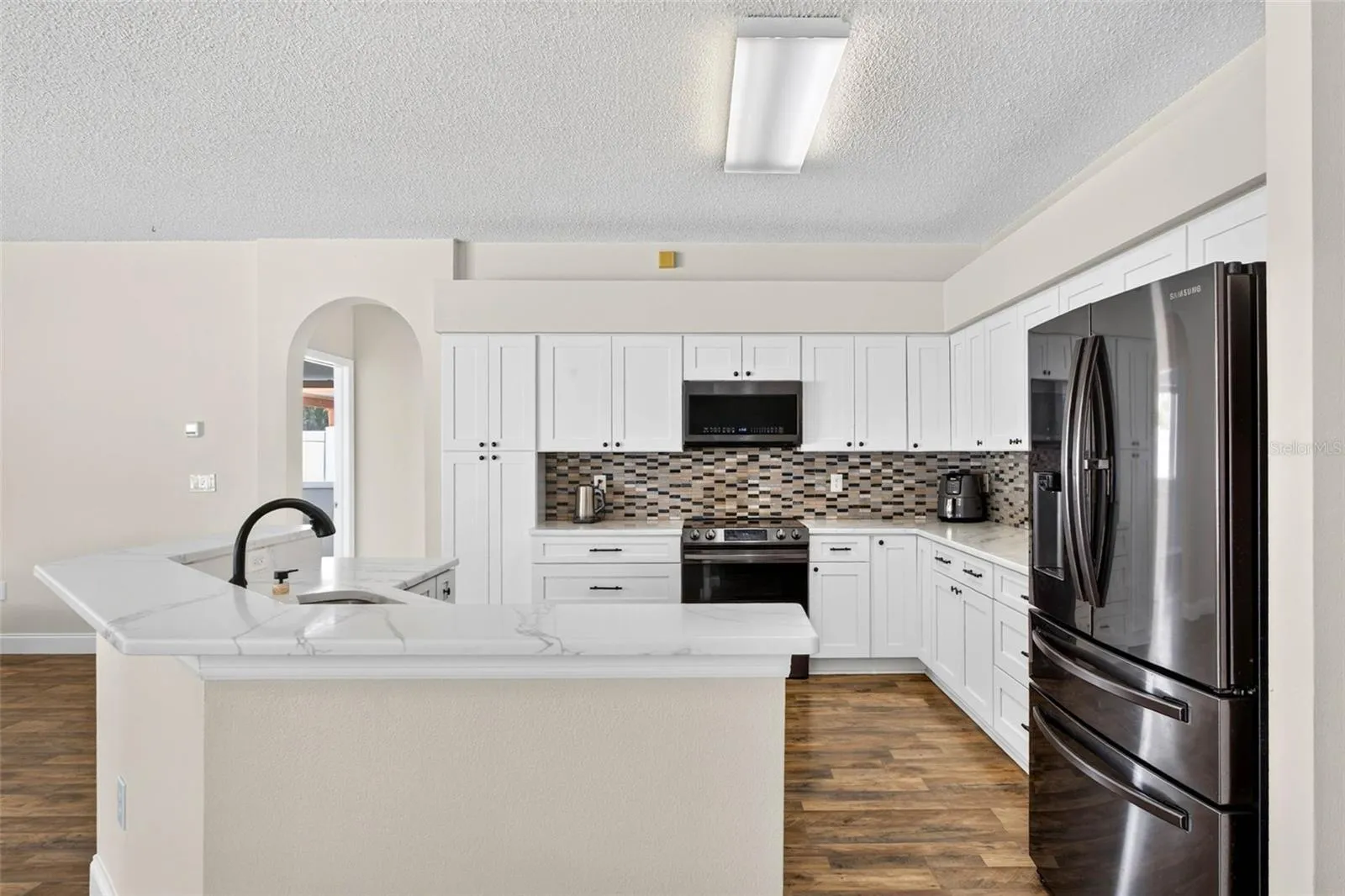 UPDATED kitchen with Quartz countertops and stainless appliances